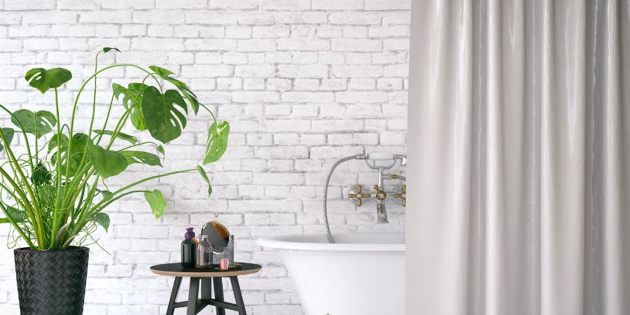A fekete és a zöld kombinációja az ipari stílusú loft fürdőszobában